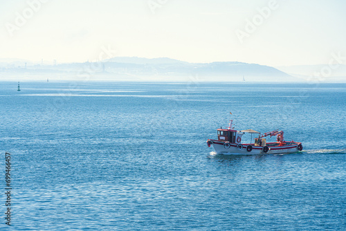 A vessel sails on the Atlantic Ocean coast, Galicia, Spain