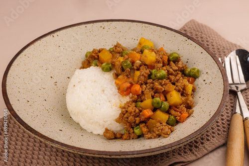 Filipino Picadillo or Giniling is a Flavorful and Hearty Combination of Ground Meat, Vegetables and Tomatoes, Served with Rice. photo