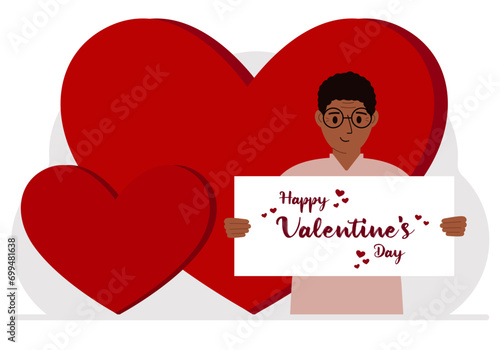 A man holds a Happy Valentine's Day greeting against a background of red hearts.