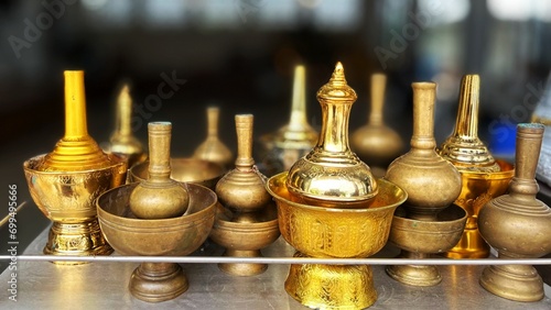 Quadro su tela Group of Plate Pour Ceremonial Water Container Thai Buddhist.