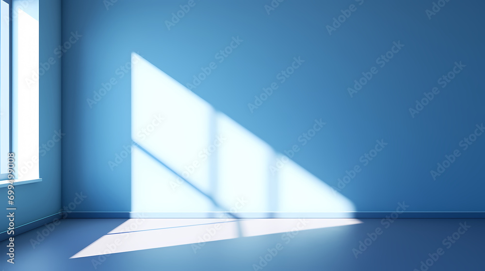 An empty blue room with a window and a shadow in the window An empty blue room with a window and a shadow in the window