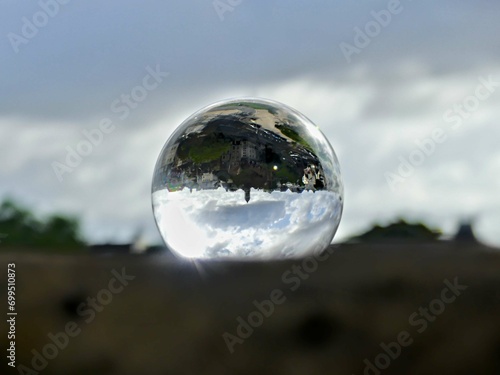 Caen, August 2023 - Visit the magnificent city of Caen, capital of Normandy. View of the city through a lens ball © Dimitri