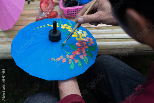 Umbrella painting, handmade fabric umbrella, Bosang umbrella in Chiang mai, Thailand photo