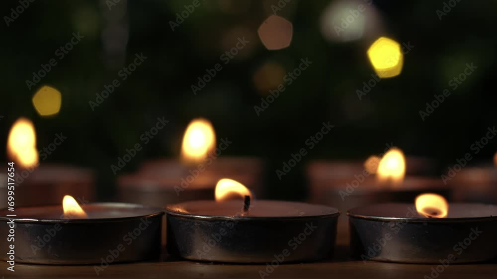 Tealight candles flickering with bokeh background Tealight candles flickering with bokeh background
