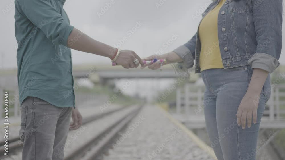 In a cultural exchange of emotions, an Indian man bestows the gift of a flute upon a woman. 4k footage In a cultural exchange of emotions, an Indian man bestows the gift of a flute upon a woman. 4k footage