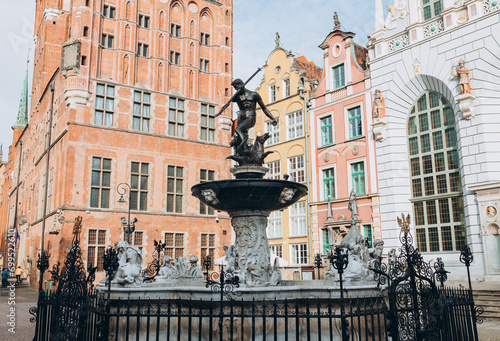 Triton statue on the market square in Gdansk, Poland. Beautiful old houses historical part of downtown, Neptune fountain, Vacation concept