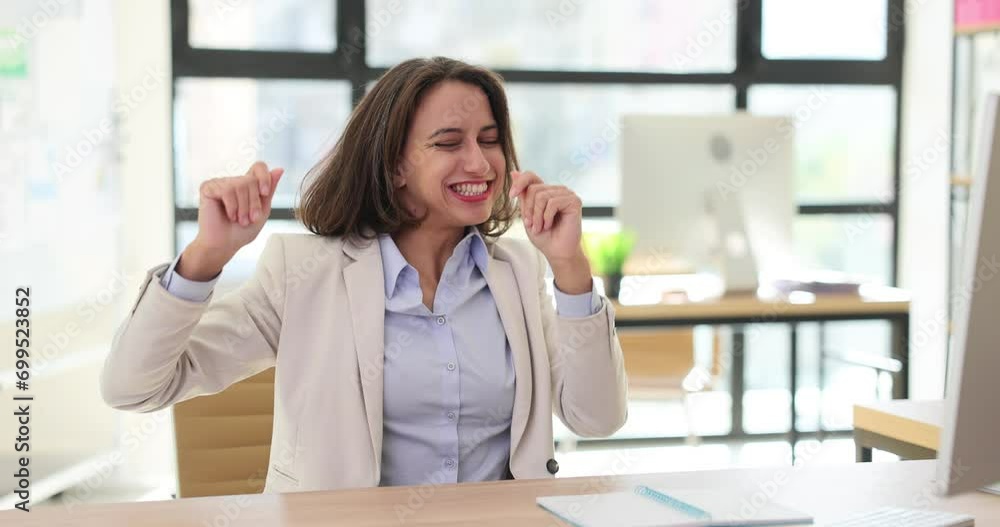 Happy businesswoman rejoicing and dancing at desk in office 4k movie slow motion Happy businesswoman rejoicing and dancing at desk in office 4k movie slow motion