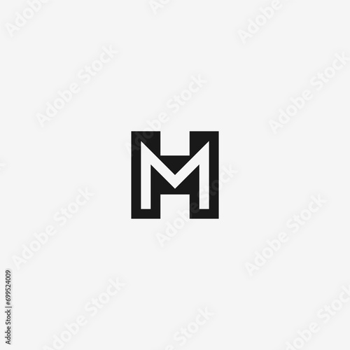 MH or HM monogram logo in black and white.