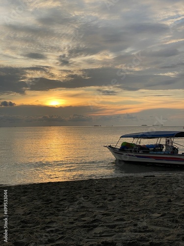 boat at sunset © Sinega