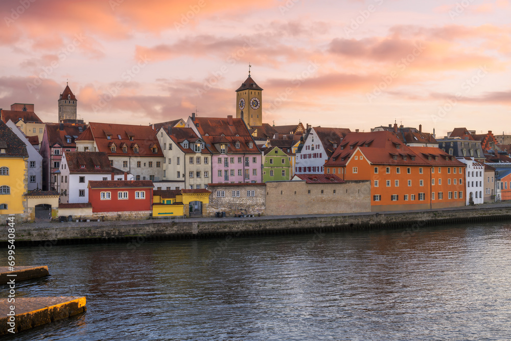 Fototapeta premium Cityscape of Regensburg at the river Daube during sunset