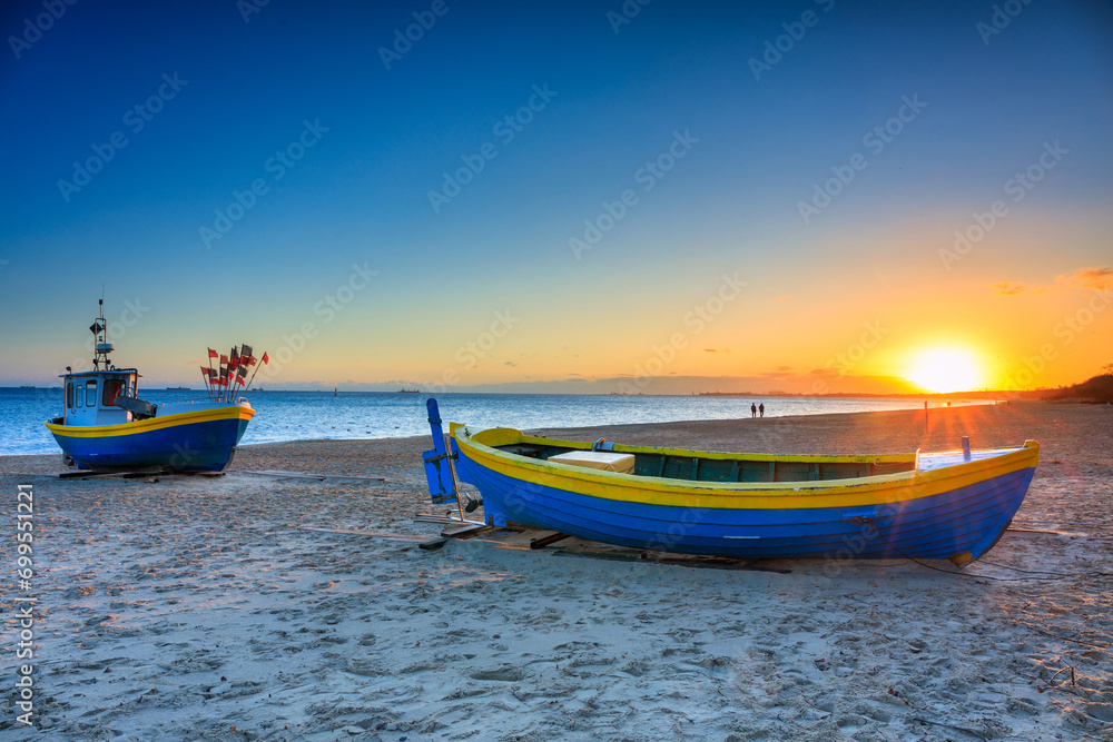 Fishing boats on the beach of Baltic Sea in Sopot at sunrise, Poland Fishing boats on the beach of Baltic Sea in Sopot at sunrise, Poland