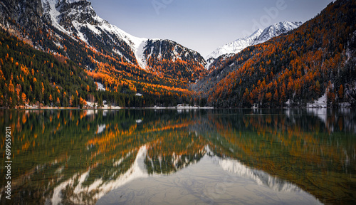 reflections in the Anterselva lake in autumn season
