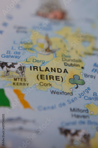 Photography tourist map of ireland with ireland flag next to it.