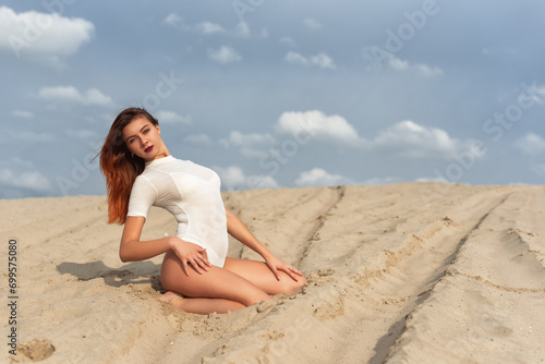 Tall girl on a sand dune © bombardir7