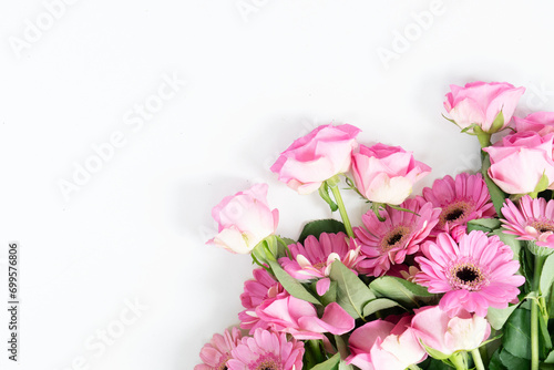 Happy womens day 8th of march background, bouquet of roses and herberas over plain green background