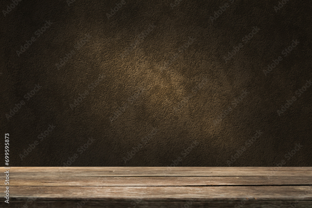 image of a wooden table on an abstract dark background with a light in the center image of a wooden table on an abstract dark background with a light in the center