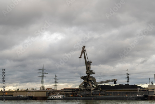 cranes in port unloading coal