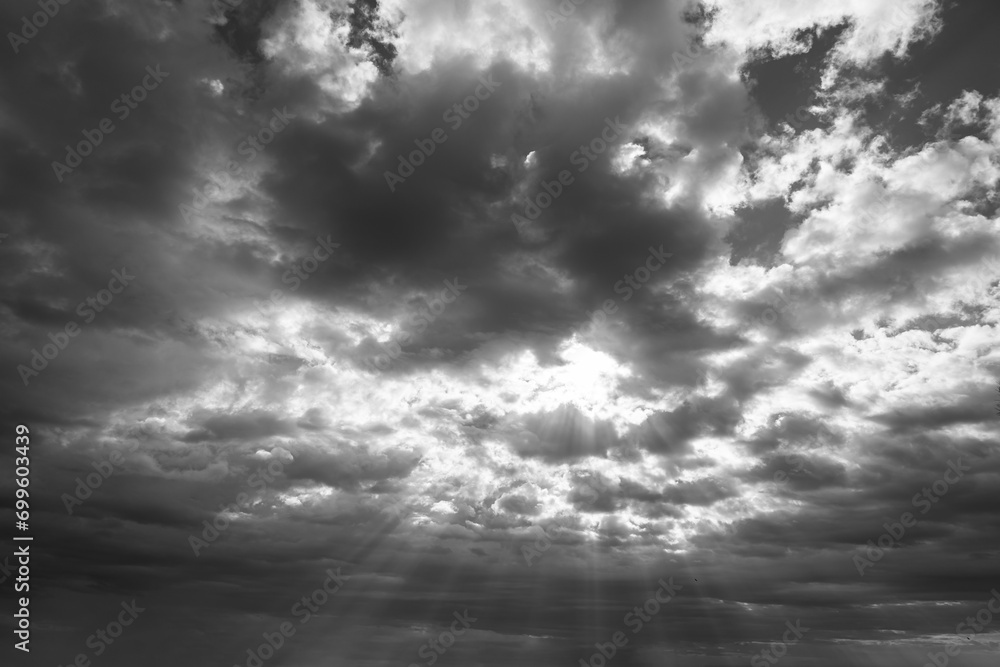 Sunrays and cloudscape. Overcast sky or stormy weather background.