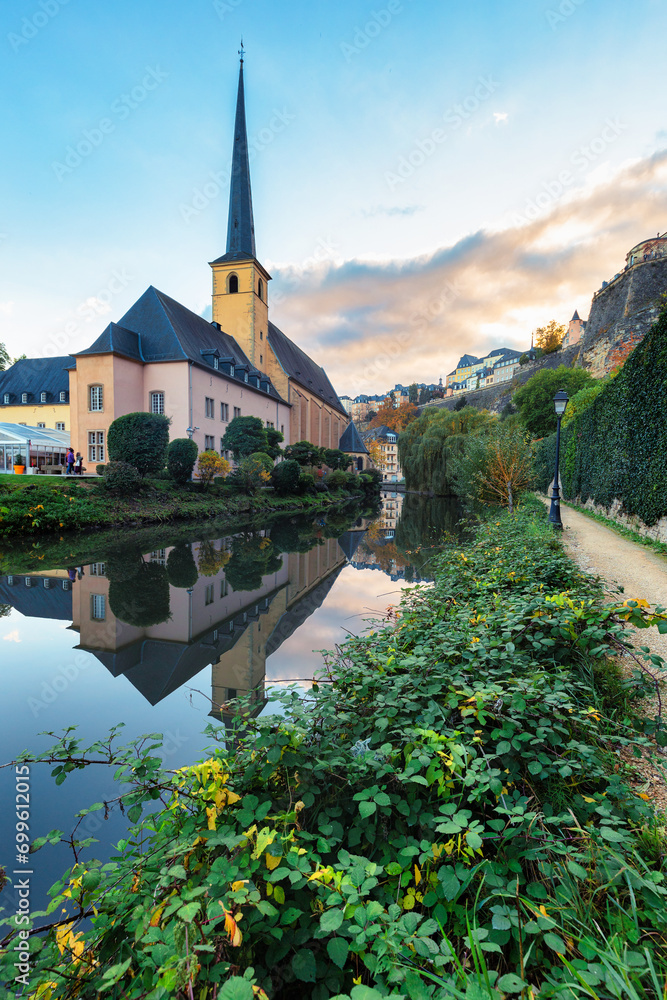 Luxembourg city church view with reflection in Alzette river