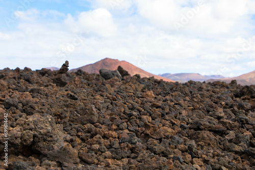 Spectacular view of the volcanic landscape in Timanfaya National Park. Lanzarote, Canary Islands, Spain, Atlantic, Europe. Tourism and vacations concept.