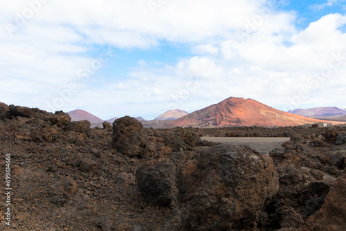 Spectacular view of the volcanic landscape in Timanfaya National Park. Lanzarote, Canary Islands, Spain, Atlantic, Europe. Tourism and vacations concept.