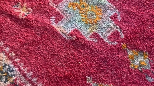 Detail of a handmade, traditional, Moroccan cactus silk (Sabra silk) rug, carpet. Macro closeup abstract geometric patterns, handwoven, shallow depth of field.
