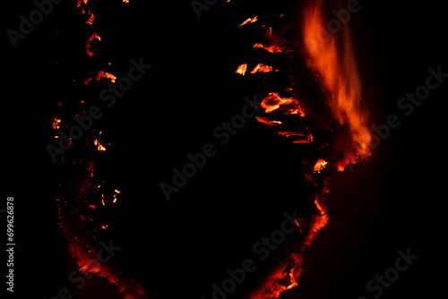 burning paper  glowing edge of paper on a black background