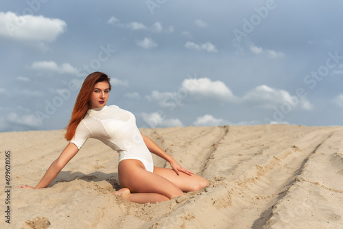 Tall girl on a sand dune