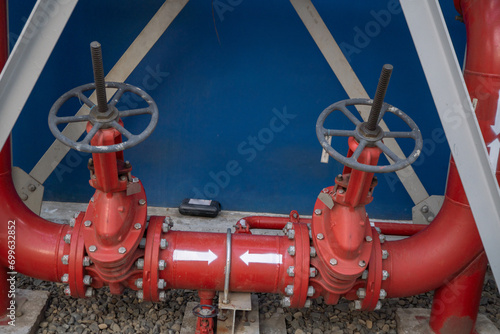 Fire pipe line and manual gate valve on the power plant project. The photo is suitable to use for industry background photography, power plant poster and maintenance content media. photo