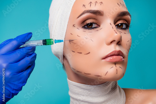 Fotografie Photo of lady plastic surgery patient having injection with botox filler in chee