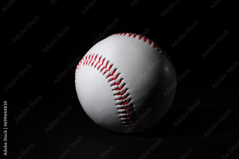 One leather baseball ball on black background One leather baseball ball on black background