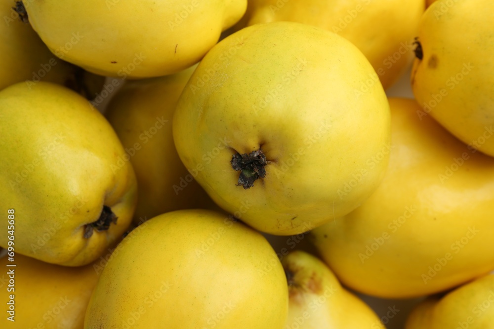 Delicious ripe quinces as background, closeup view Delicious ripe quinces as background, closeup view