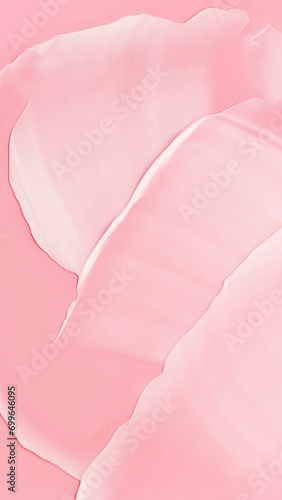 Textura de una crema de cosmética, sobre un fondo rosa.  photo