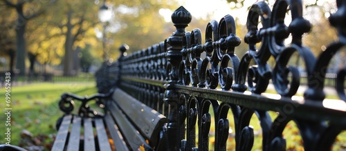 Park railings with geometric design.