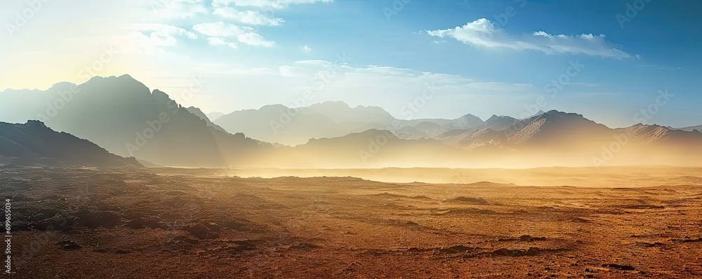 Naklejka premium Majestic landscape of sand sun and rocky peaks at sunset. Golden horizons. Panoramic view of arid desert bathed in warmth of setting sun. Endless sands. Journey vast and serene at dusk