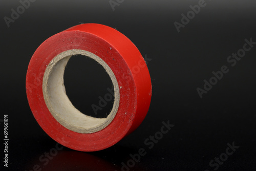 Colored insulating tape in a roll for electrical work.