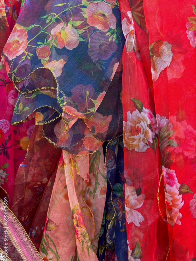 Close-up of multi-colored scarves , dupatta stola chunri , stola showing fabric and patterns used by ladies in clothing Close-up of multi-colored scarves , dupatta stola chunri , stola showing fabric and patterns used by ladies in clothing