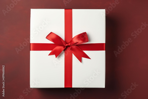 Elegant White Gift Box with Red Ribbon, Top View on Red Background, Celebrations, Christmas, Happy, Birthday, surprise, package.