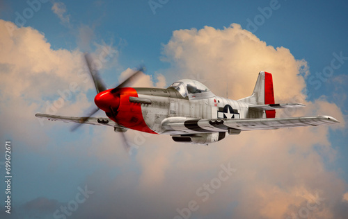 Fotografie P-51 Mustang World War II era fighter with Red Tail squadron paint scheme flies
