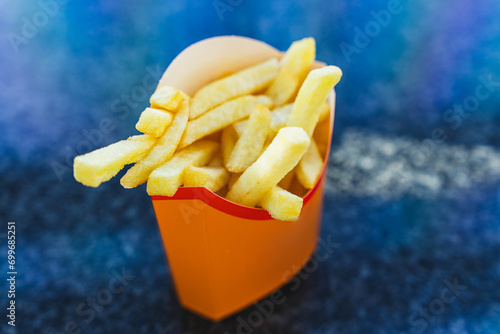 Tasty and Crispy French Fries in a Traditional Paper Cup, Perfect for Snacking and Fast Food Lovers