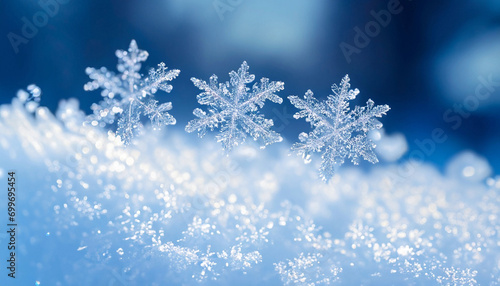 Snowflakes close-up with winter wonderland in the background, blue background, winter and Christmas card