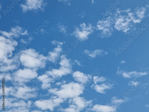 abstract outdoor sunny day blue sky high small group clouds background in summer gradient light white background. beautiful bright cloud and calm fresh wind air.
