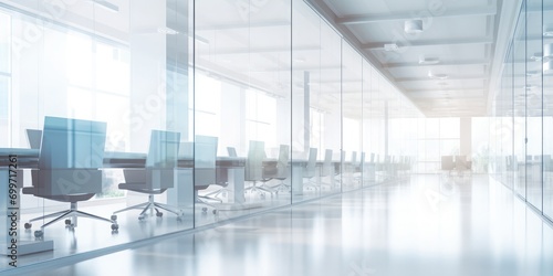 Blurred white empty open space office. Natural lights in defocused blurred background, office interior background for design. 