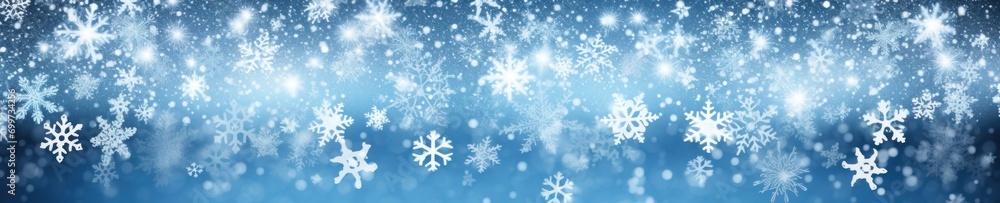 Christmas banner of white snowflakes on a blurred blue background Christmas banner of white snowflakes on a blurred blue background