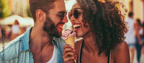 Joyful pair enjoying a rendezvous while indulging in ice cream.