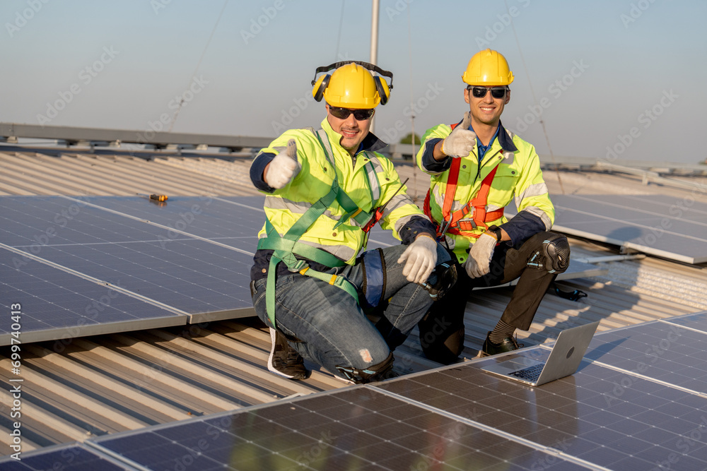 custom made wallpaper toronto digitalTwo industrial technician worker sit near solar cell panels on rooftop of factory building and show thumbs up to camera with smiling. Green and sustainable energy concept.
