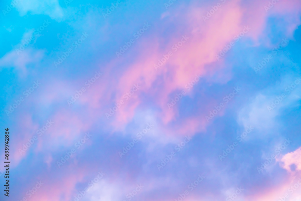 Blue morning sky is in pink clouds. Sunrise clouds are in vanilla colours. Beauty in nature. Twilight time, golden hour. Details of evening sunset. Natural abstraction. Peace concept. Panoramic view