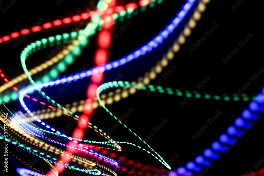 A photograph of vibrant multi-color lights in a long exposure photo. Light painting photography A photograph of vibrant multi-color lights in a long exposure photo. Light painting photography
