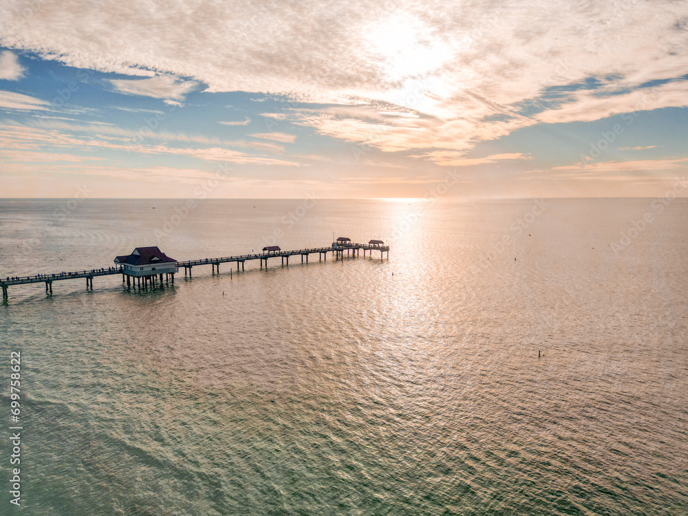 defaultCoastal city with a view of the ocean, taken from above with a drone. Clearwater Beach. Pier at clearwater beach jutting into the ocean at sunset