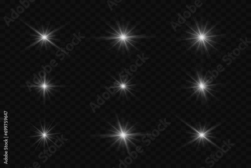 A collection of bright stars and moments. The effect of flashing rays and flickering highlights. On a transparent background. photo